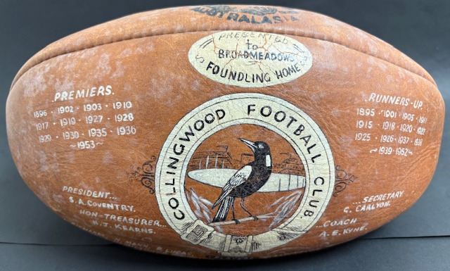 1950s hand-painted football, given to the Broadmeadows Foundling Home (presumably as a fundraiser)